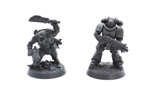 AdeptiCon 2026 promo miniatures featuring an Ork and Space Marine from Warhammer 40,000, showcased in a tabletop wargaming review.