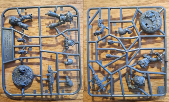 AdeptiCon 2026 promo miniatures featuring an Ork and Space Marine from Warhammer 40,000, showcased in a tabletop wargaming review.