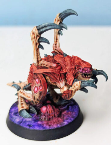 StarCraft tabletop miniature painting tutorial showing how to paint a Zerg miniature with detailed colors and techniques.